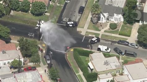 Stolen car thief crashes into LAPD squad car, shears fire hydrant