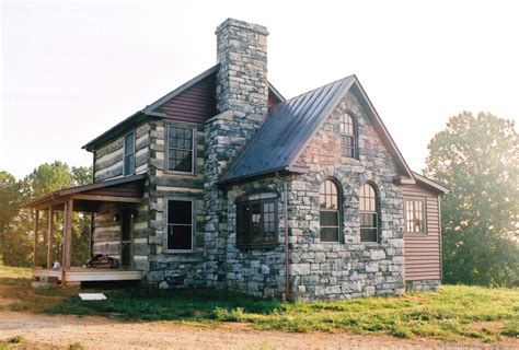 Stone cabin. Rustic Stone Exterior Home Ideas. This transitional timber frame home features a wrap-around porch designed to take advantage of its lakeside setting and mountain views. Natural stone, including river rock, granite and Tennessee field stone, is combined with wavy edge siding and a cedar shingle roof to marry the exterior of the home with it ... 