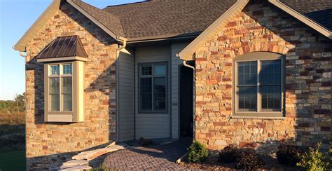 Stone siding house. When it comes to improving the exterior of your home, hiring a professional Lansing siding company is crucial. Siding not only enhances the aesthetics of your house but also provid... 