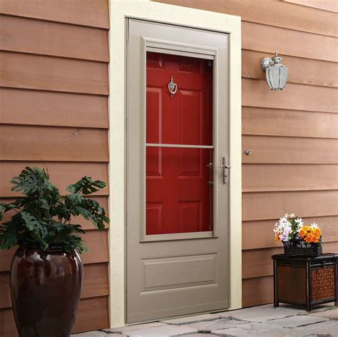 Storm door installation lowepercent27s. The LARSON 83001042 83001 36″BRN Storm Door is a heavy-duty, solid storm door that weighs 70-pounds. The Larson storm door comes with hardware for hanging the door, including a tool to help you drill holes. The door uses solid materials, including a screen installed at the top panel of the door. 