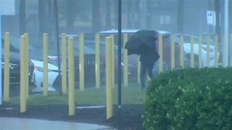 Storm system brings heavy downpours and whipping winds across South Florida, triggering flooding concerns