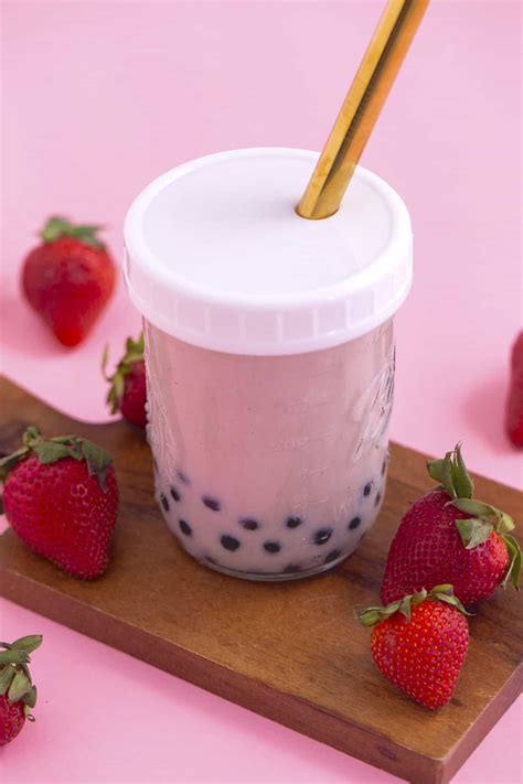 Strawberry milk tea boba. Assemble classic brown sugar dirty boba. Take 2 or 3 spoonfuls of boba pearls, already attached with the syrup to the glass cup. Rotate to drizzle evenly or use a scoop to help. Add sweetened condensed milk if using. And then add fresh milk to complete. This is the version with a tiger strip from the Tiger brand. 