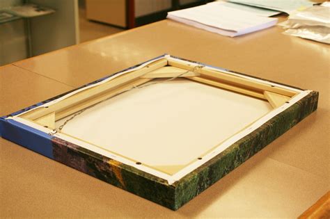 Stretch canvas. 1. Round or angle the wood edges. Use sandpaper to round the inside edges of the wood. Another option is to use a table saw, router, or planer to angle … 
