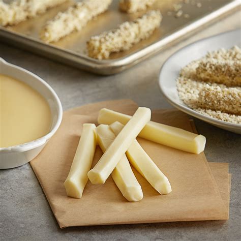 String cheese sticks. Place your flour in a bowl and lightly coat each string cheese piece with flour. In another bowl mix together the egg and milk. Mix together the panko crumbs, Italian seasoning, pepper and garlic salt in a shallow pan. I love using a pie tin. Pour your canola oil into a deep skillet to the height of 1″ up the side. 