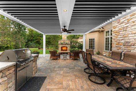 Struxure - Project Name: Abundant Angles Location: Houston, Ohio Dealer: StruXure Outdoor Ohio Product: Bronze, Pergola X – Pivot 6 In need of a covered space in which to enjoy more outdoor activities with family, this couple was told by several contractors that their multi-angled patio and house façade would require replacing an exterior wall of their home in …