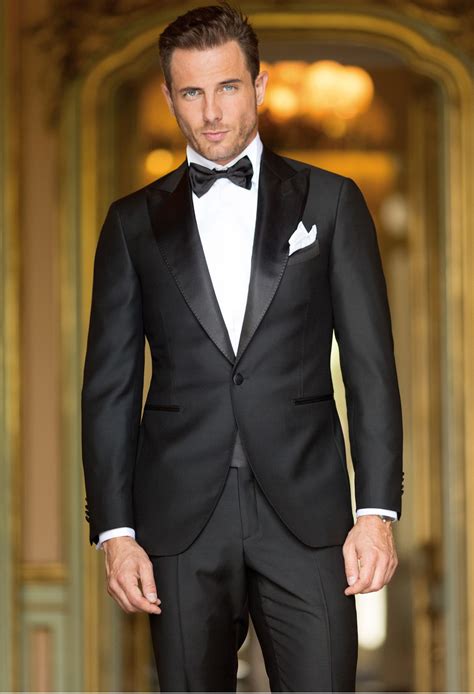 Suit or tux for wedding. Normal wedding suits with 2 buttons and notched lapels in grey, black or blue. Waistcoats can be made of same fabrics of the suit but only if they are shawl ... 