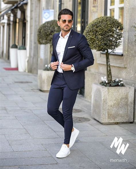 Suit with tennis shoes. It was first designed as a tennis shoe, as the name suggests, and became popular within the sport through the 1980s. Then, in 2009, J.Crew struck a deal with Nike to revive the style as an ... 
