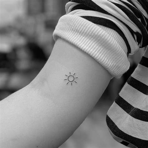 Sun tattoo minimalist. If you are looking for a tattoo that represents strength, power, and vitality, then a sun tattoo may be the perfect choice for you. The sun has been a symbol of life, energy, ... minimalist depiction of the sun. It can represent simplicity, clarity, and focus. When choosing a sun tattoo design, consider what the sun means to you personally. 