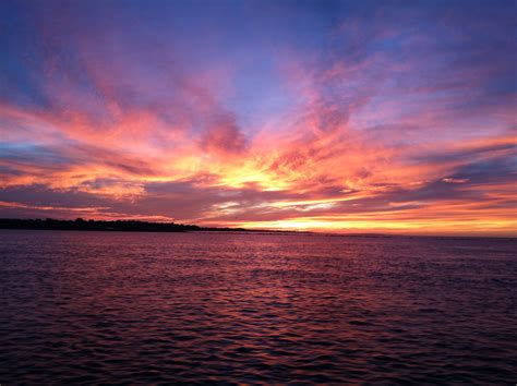 Sunset in june. Key West, Florida is known for its breathtaking sunsets, and one of the best places to witness this natural beauty is Mallory Square. Key West is famous for its stunning sunsets, a... 