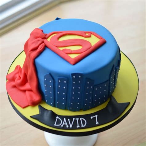 Superman cake. Superman Cake. Perfect for any Superhero! The Super Man cake pictured is a standard height cake (3″-4″ tall), but can also be made available in a number of flavours and sizes. Delivery is not included in this order. After completing your purchase please arrange delivery through Zoom2u. 