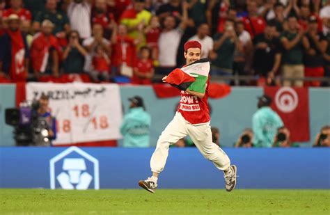 Supporter runs onto pitch during Tunisia v France game with …