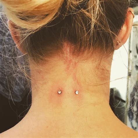 Surface piercing. Surface Piercings. Flat regions of a body, such as the breast or upper face, are pierced via surface piercing. Surface piercings have entry as well as exit holes adjacent to each other on the top of the skin, unlike other piercing kinds that have an entry hole and an exit hole that is actually behind the entry hole. 