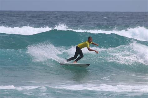 Surfers paddle into 60th birthday celebrations in style