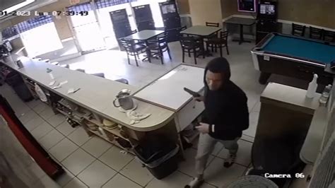 Surveillance footage captures alleged armed robber stealing cash register from restaurant in Hialeah
