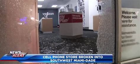 Surveillance video captures vandals breaking into Verizon store, stealing merchandise inside