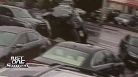 Surveillance video shows car crash into parking lot in Brockton