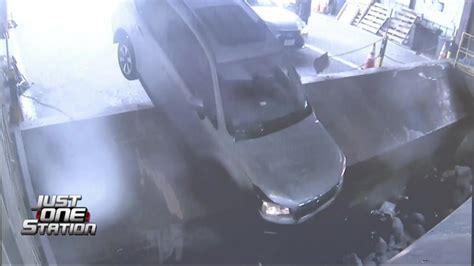 Surveillance video shows driver crash car into trash compactor in Southboro
