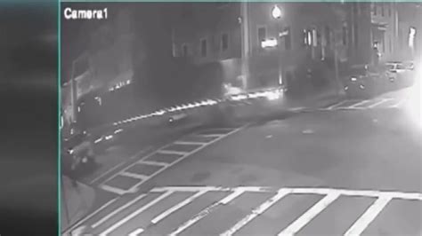 Surveillance video shows tractor-trailer crashing into parked car in South Boston