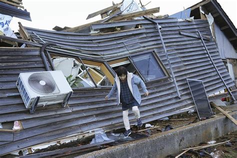 Survivors are found in homes smashed by Japan quake that killed 98 people. Dozens are still missing