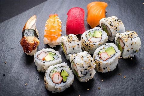 Sushi kabar. A Pink Lady sushi roll contains pink nori, which is an edible paper made from soybeans. Tuna and asparagus are also included in the roll. The dish is topped with a sauce made of av... 