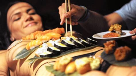 Sushi served on nude girl. .  ...