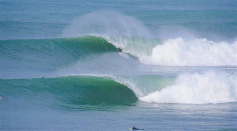 surfers take on big winter time swell at Swamisoceansideencinitascarlsbadcardiffsan diego. 