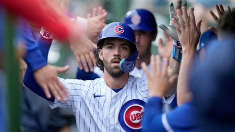 Swanson and Candelario go deep as the Cubs hold off the Braves 8-6 at rainy Wrigley