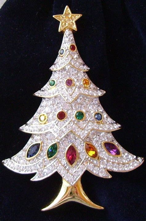 Check out our swarovski angel pin selection for the very best in unique or custom, handmade pieces from our brooches shops. ... 1970 Signed Nina Ricci Rhinestone and Pearl Angel Christmas Tree Brooch 18k Gold Plated Faux …