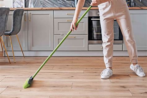 Sweep the floor. Before mopping, sweep or vacuum the floor to remove grit, hair, and other large particles. Removing the everyday accumulation of dirt first makes the task of mopping less arduous. Be sure to blot dry any wet areas before sweeping or vacuuming; otherwise, you'll dirty the floor further by spreading the grime. 