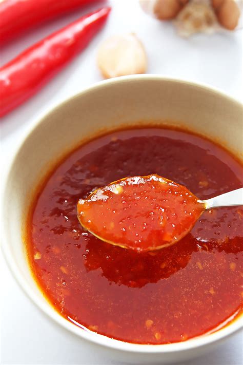 Sweet chili. Sweet chili sauce (also known as Thai Sweet chili sauce ), known as nam chim kai in Thailand ( Thai: น้ำจิ้มไก่; lit. 'dipping sauce for chicken'), is a popular chili sauce condiment in Thai, Afghan, Malaysian, and Western cuisine. It is commonly made with red chili peppers (often Fresno chile, Thai or red jalapeños ), rice ... 
