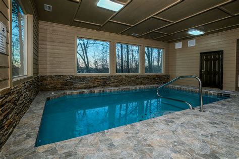 Swim and gym mansion sevierville tn. The Swim and Gym Mansion Pigeon Forge Tn, Tennessee is a beautiful and luxurious vacation rental home that can accommodate up to 22 guests. This stunning nine-bedroom, eight-bathroom home features an indoor heated pool, hot tub, game room, theater room, and much more. 