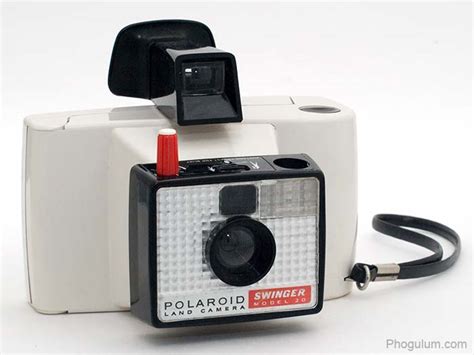 Full name: Polaroid Land Camera Swinger model 20 International version Found this one in the same spot where I found most of my other Polaroid cameras, a Dutch thrift store. The back has instructions all in Dutch, very cute.. 
