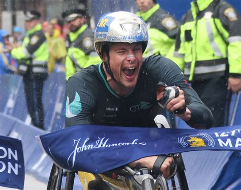 Switzerland’s Marcel Hug wins wheelchair race in course record time