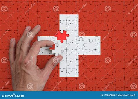 White symbol on Switzerland's flag. Crossword Clue Here