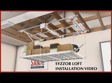 Syzzor loft. Designed to eliminate the need for a ladder, the Syzzor Loft from Hafele features a retractable overhead garage storage rack that can be raised and lowered u... 