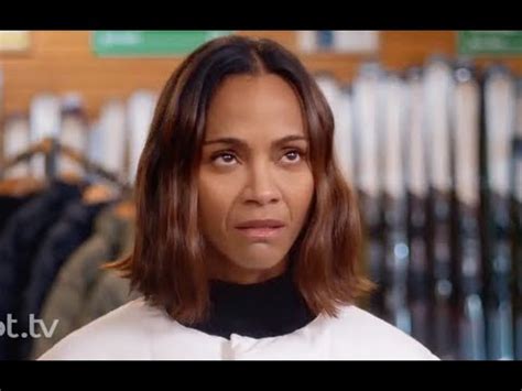 In the holiday-themed commercial that began airing in 2023, Saldana notices a family all using the new iPhone 15, looking on with jealousy. As she stands in front of a mirror, Saldana's reflection encourages her: "You're an action star: take action!" Then, the reflection informs her of the iPhone deal customers can get if they switch to T-Mobile.