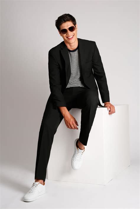 T shirt in suit. Black T-Shirt With A Suit. T-shirts these days play a crucial role in the smart casual space for men. Black t-shirts in particular add to this dress code but with a slicker aesthetic (it is black ... 