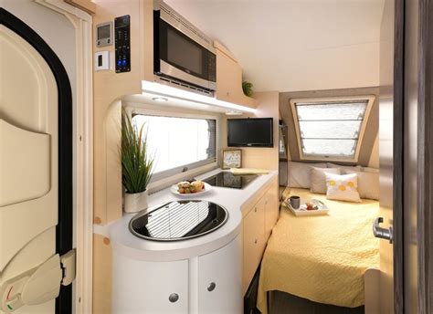 The TAB 400 is built with the unique teardrop design on a single axle, and includes composite flooring, molded underbelly shield, and a rear stargazer window allowing you to stargaze at night. There is a 310 watt solar panel included allowing you to camp off-grid, and the Alde central heating/hot water system plus the central air conditioning ...