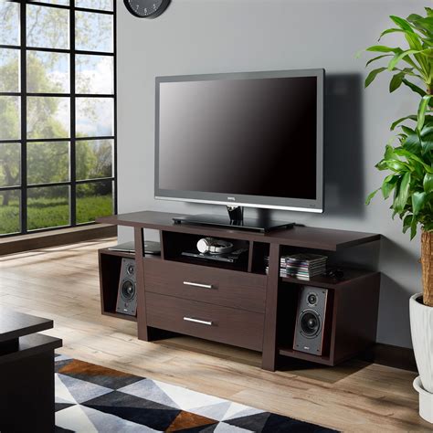 Expensive. Only one cable hole. For a large living space, you may want an oversized media console, such as the Camryn TV Stand. This beautifully made piece is 79 inches long, allowing you to place a TV up to …. 