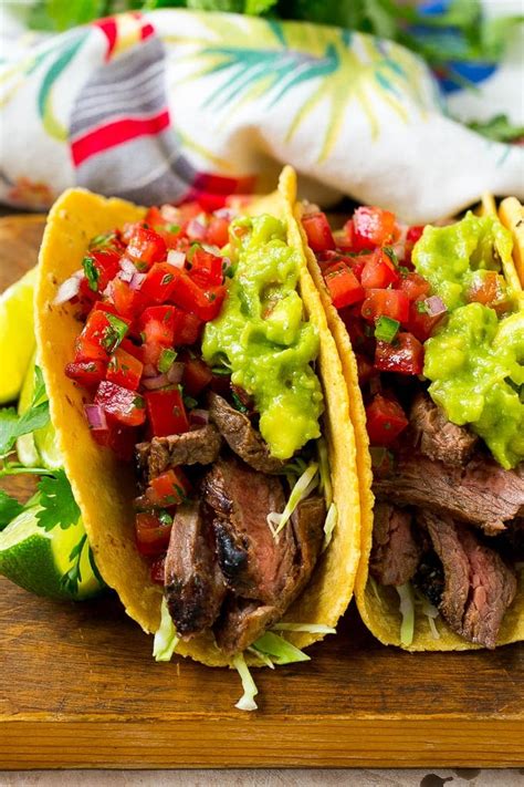 Tacos de carne asada. Warm tortillas in the microwave, in a skillet or char on the grill or open gas stovetop flame until warm but still pliable (detailed instructions in notes). Assemble Street Tacos by layering warmed corn tortillas with carne asada steak, pico de gallo, guacamole, sour cream and cotija. 