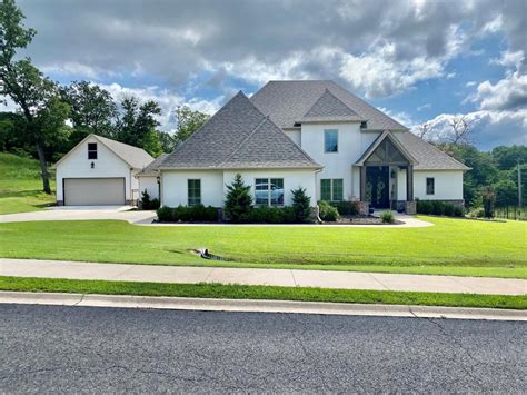 2,097 Sq Ft. 17238 S Muskogee Ave, Tahlequah, OK 74464. 8.19 +/- acres with a pond and highway frontage. 4 bedroom, 3 bathroom, 1 car garage and a carport. Also has a shed and a barn. Multiple pecan trees on the property. Close to the Cherokee Nation Complex. Justin Smith C21/Wright Real Estate. $386,000. 4 Beds.. 