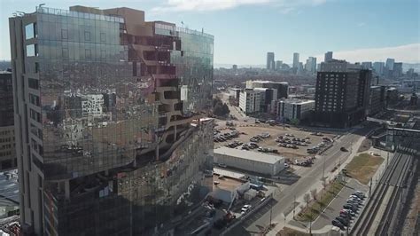 Take a look inside Denver's newest apartment building with a tree-filled canyon
