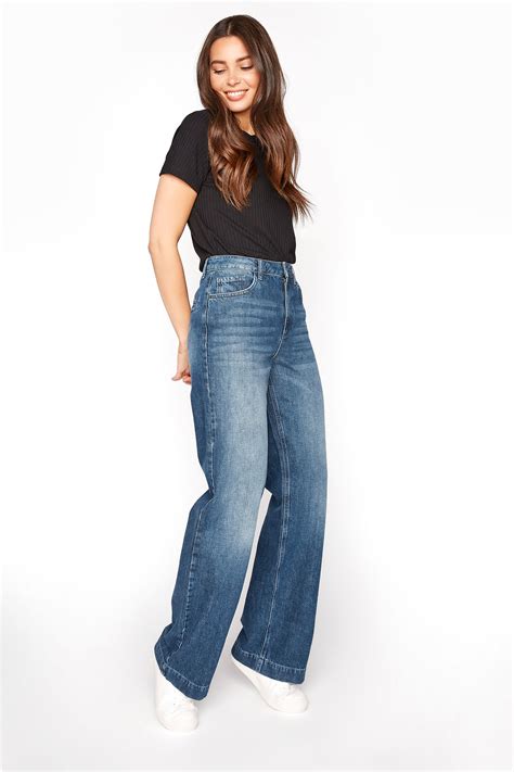 Tall wide leg jeans. The cut: the latest addition to our Perfect Vintage fam, these cropped jeans combine our classic high fitted waist with slouchy wide legs. The fabric: vintage-y structured denim with a touch of stretch for a broken-in feel. Please note: we suggest going down one size for a snugger fit at the waist. 11 1/4" high rise, 18" leg opening, 30" inseam ... 
