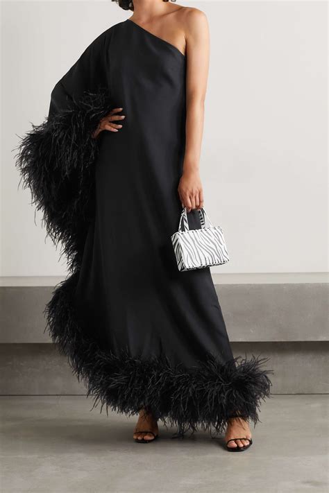 Taller marmo. Named after Mrs. Lollobrigida, the Gina Velvet is a short dress made of luxurious velvet. It has the boxy and laid-back fit of a 1960s MOD dress with a high neck, long sleeves, and a hem fully trimmed with a fluffy boa of ostrich feathers. 