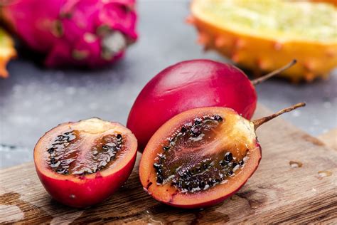 Tamarillo is also known as a tree tomato. · The flesh of this fruit is orange and contains black edible seeds. Tamarillo has a slightly sweet and intense flavour .... 