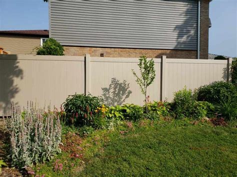 Tan vinyl fence post.  Long-lasting Impact modifiers for strength UV L...