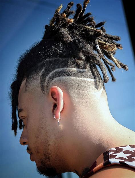 This style creates emphasis on the parting, making for a sharp and defined look. 10. Afro Taper Fade. Afro Taper Fade via instagram. The Afro taper fade is a popular and trendy haircut for black men that combines the classic look of an afro with the sharp and modern lines of a taper fade.. 