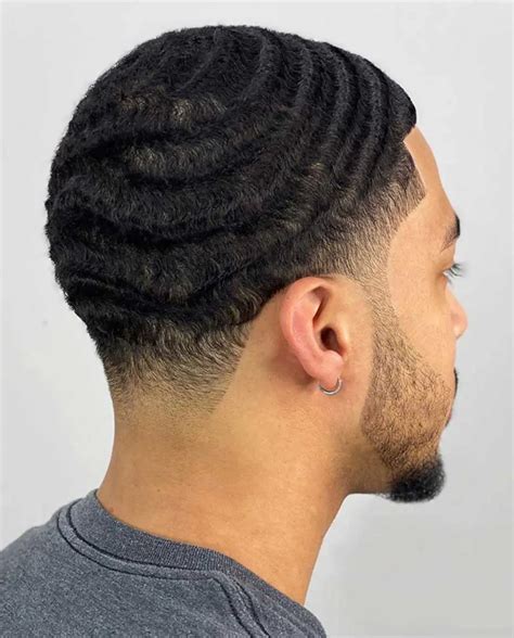 Taper waves. 6. Temp Fade with Waves. T waves haircut looks best with a gentle temple fade on the sides sporting precision edging and lining. Here’s a temp fade around the ear with a taper towards the back. The beard is lined expertly, with the sideburns fading into the temples. Short waves with temple skin fade. 7. Temp Fade With Side Part and Pompadour 