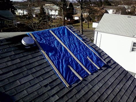 Tarp on roof. May 6, 2021 · Secure the Tarp. Once you have all of the boards in position, screw the boards in place using your screwdriver. There should be some excess tarp hanging over the roof. Take a 2×4 and place it under the edge of your roof. Take the extra tarp and secure it with 2×4 to keep water from blowing underneath the tarp. 6. 