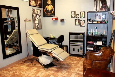 Tatoo studio. A tattoo is a form of body modification made by inserting tattoo ink, dyes, and/or pigments, either indelible or temporary, into the dermis layer of the skin to form a design. Tattoo artists create these designs using several tattooing processes and techniques, including hand-tapped traditional tattoos and modern tattoo machines. 